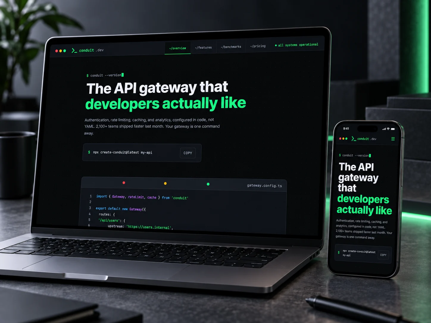 Conduit's homepage on a laptop and a phone on a dark desk
