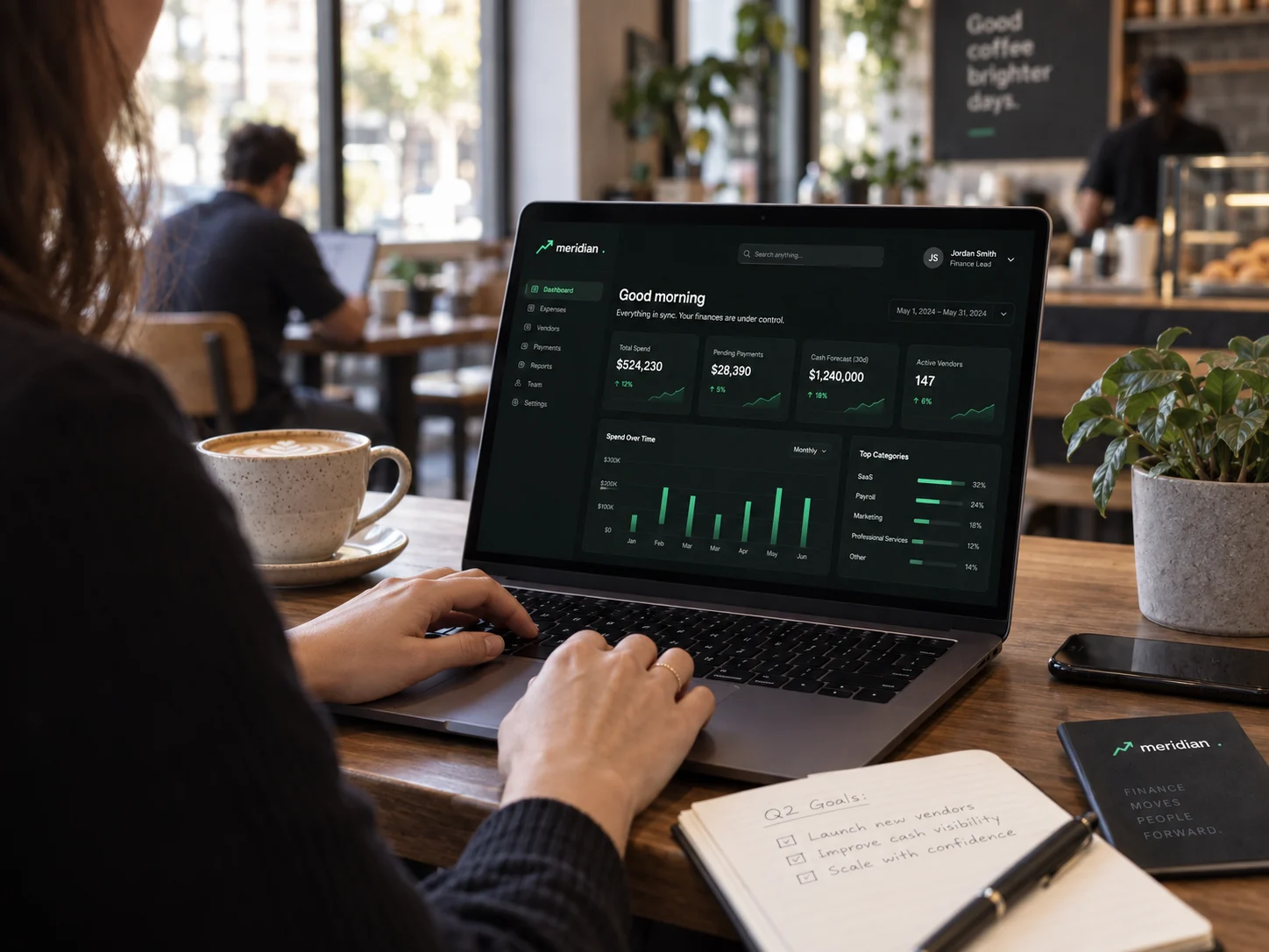 Meridian on a laptop in a café