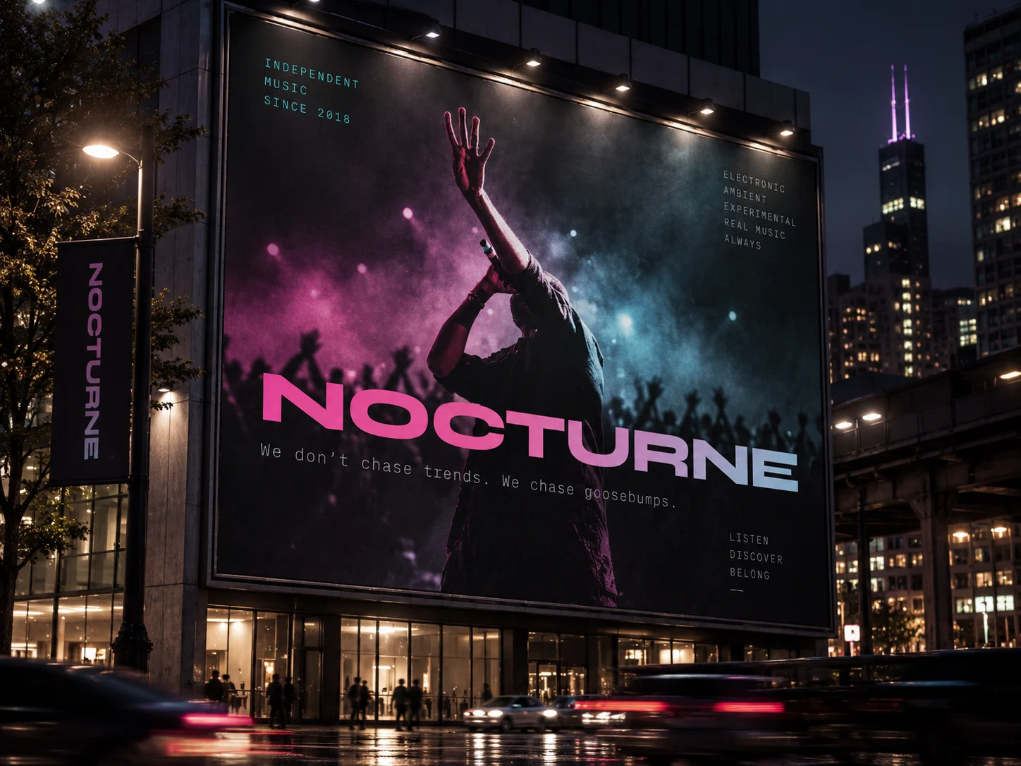 A Nocturne billboard on the side of a building at night